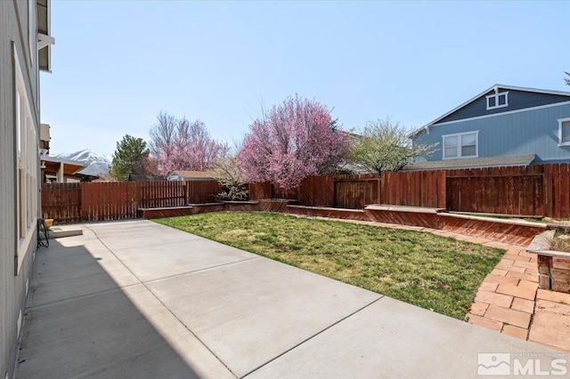 7753 Tulear St, Reno, NV 89506 - view of yard with a patio area