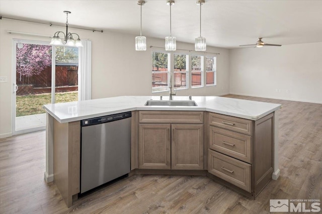 7753 Tulear St, Reno, NV 89506 - kitchen featuring dishwasher, a sink, light wood-type flooring, and a ceiling fan
