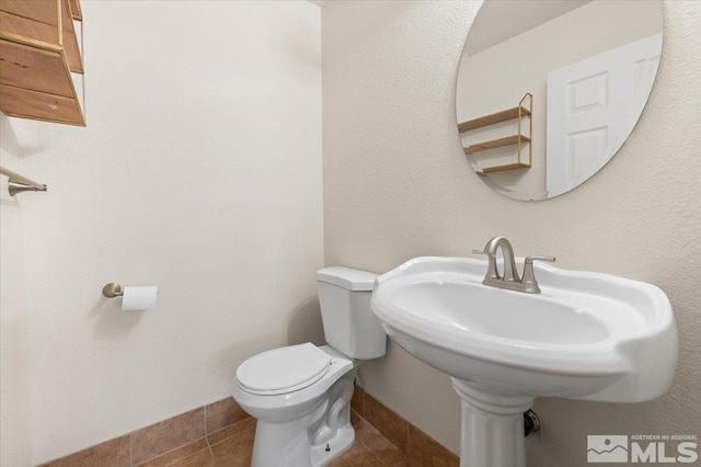 7753 Tulear St, Reno, NV 89506 - bathroom with toilet and tile patterned flooring