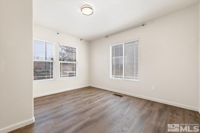 7753 Tulear St, Reno, NV 89506 - unfurnished room featuring baseboards and wood finished floors