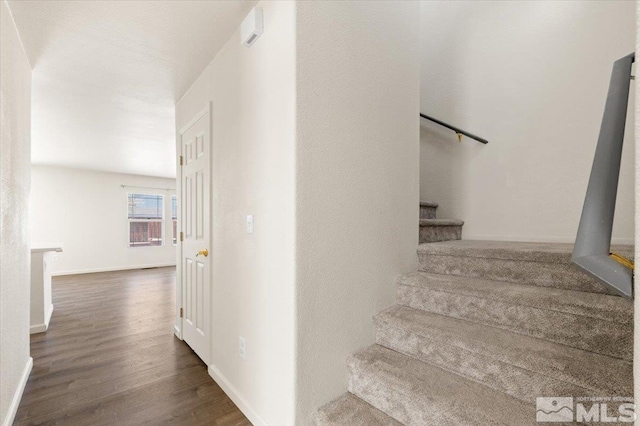 7753 Tulear St, Reno, NV 89506 - staircase featuring wood finished floors and baseboards