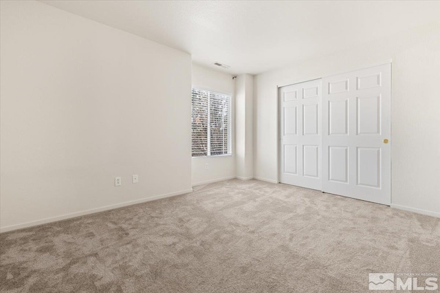 7753 Tulear St, Reno, NV 89506 - unfurnished bedroom with carpet, baseboards, and a closet
