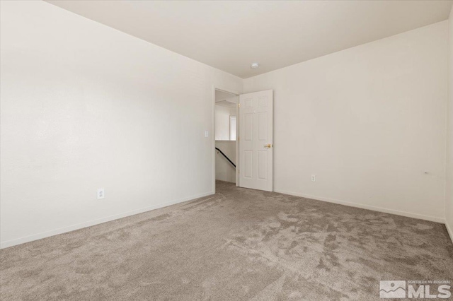 7753 Tulear St, Reno, NV 89506 - unfurnished room with carpet flooring and baseboards