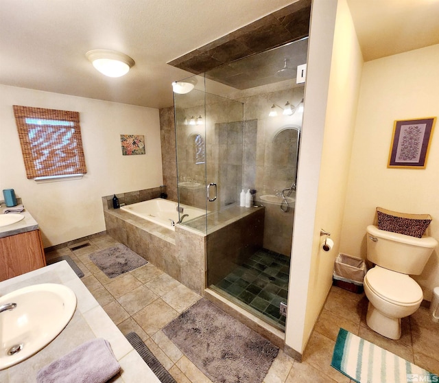 495 Burntwood St, Fallon, NV 89406 - bathroom featuring vanity, tile patterned floors, toilet, a stall shower, and a bath
