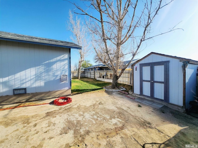 495 Burntwood St, Fallon, NV 89406 - view of yard with a storage shed, fence, and an outdoor structure