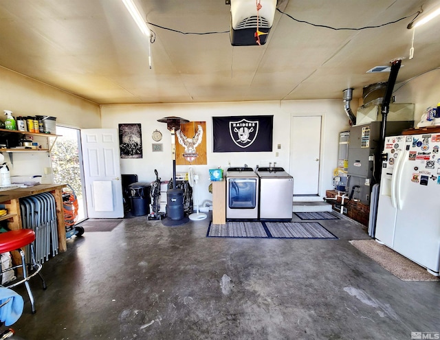 495 Burntwood St, Fallon, NV 89406 - garage with white refrigerator with ice dispenser, a garage door opener, washer and clothes dryer, and gas water heater