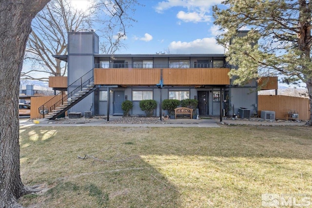2165 Kietzke Ln Unit D, Reno, NV 89502 - back of house featuring stairway, central AC, and a chimney