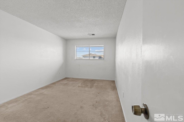 2165 Kietzke Ln Unit D, Reno, NV 89502 - carpeted spare room with a textured ceiling and baseboards