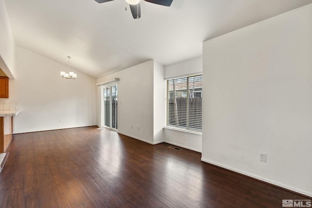 4251 Furgerson Ranch Rd, Carson City, NV 89701 - unfurnished living room with a ceiling fan, a chandelier, lofted ceiling, dark wood-type flooring, and baseboards