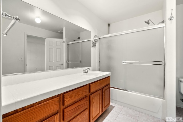 4251 Furgerson Ranch Rd, Carson City, NV 89701 - full bathroom with vanity, combined bath / shower with glass door, tile patterned floors, and toilet