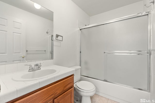 4251 Furgerson Ranch Rd, Carson City, NV 89701 - bathroom featuring toilet, combined bath / shower with glass door, vanity, and tile patterned floors
