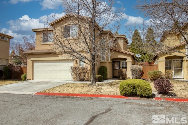 2078 Tivoli, Sparks, NV 89434 - traditional home featuring a garage, fence, driveway, and stucco siding