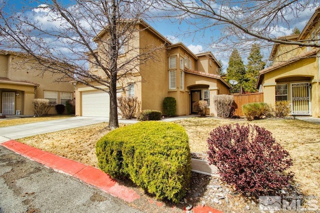 2078 Tivoli, Sparks, NV 89434 - view of home's exterior with stucco siding, concrete driveway, and fence