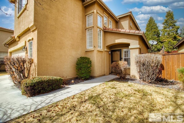 2078 Tivoli, Sparks, NV 89434 - view of front of home with stucco siding and a garage