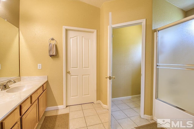 2078 Tivoli, Sparks, NV 89434 - full bath featuring tile patterned floors, vanity, a textured wall, shower / bath combination with glass door, and baseboards