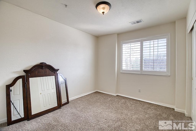 2078 Tivoli, Sparks, NV 89434 - unfurnished bedroom with carpet, baseboards, and a textured ceiling