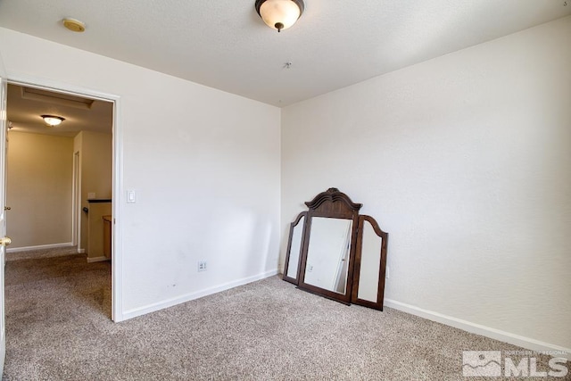 2078 Tivoli, Sparks, NV 89434 - carpeted spare room with baseboards and a smoke detector