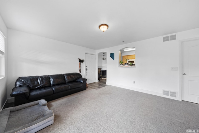 6850 Sharlands Ave # W2137, Reno, NV 89523 - living area with carpet flooring, arched walkways, and baseboards