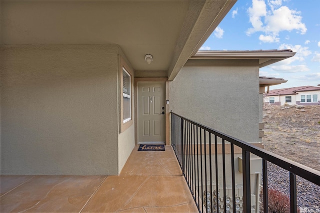 6850 Sharlands Ave # W2137, Reno, NV 89523 - property entrance with a balcony and stucco siding
