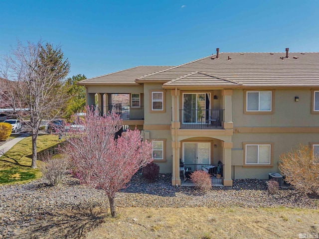 6850 Sharlands Ave # W2137, Reno, NV 89523 - rear view of property featuring a balcony, stucco siding, central AC, and a tiled roof