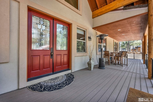 16375 Callahan Rd, Reno, NV 89511 - doorway to property featuring stucco siding, outdoor dining space, a porch, and french doors