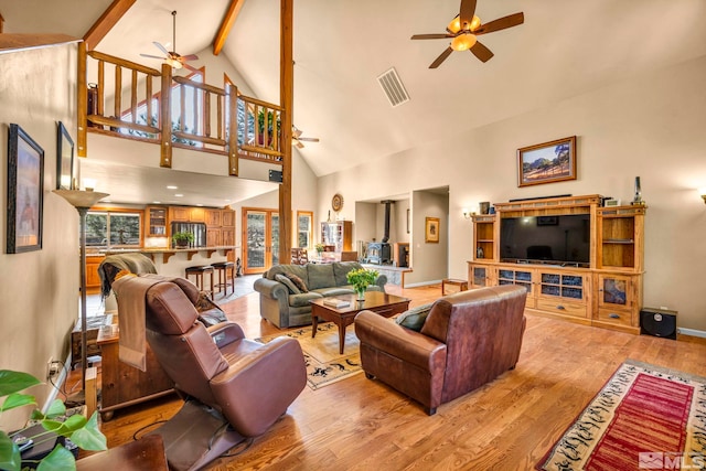 16375 Callahan Rd, Reno, NV 89511 - living area with ceiling fan, wood finished floors, high vaulted ceiling, beamed ceiling, and baseboards