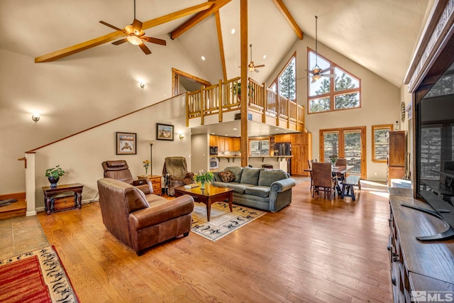 16375 Callahan Rd, Reno, NV 89511 - living area featuring ceiling fan, high vaulted ceiling, beam ceiling, wood finished floors, and healthy amount of natural light