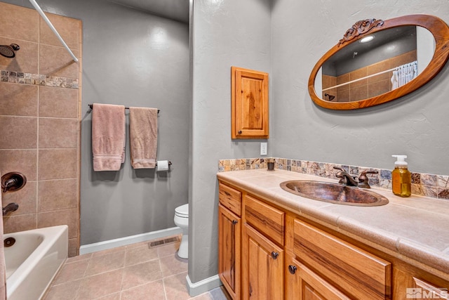 16375 Callahan Rd, Reno, NV 89511 - bathroom with toilet, vanity, tile patterned flooring,  shower combination, and baseboards
