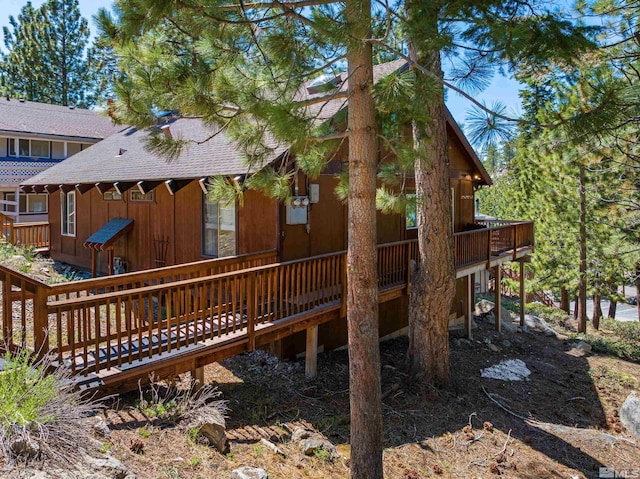 742 Tina Ct Unit B, Stateline, NV 89449 - back of property with roof with shingles and a deck