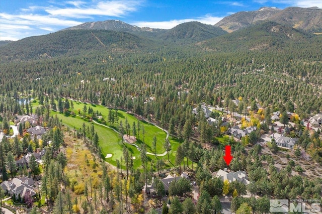 5680 Lausanne Dr, Reno, NV 89511 - aerial overview of property's location featuring a forest, a mountainous background, and nearby suburban area