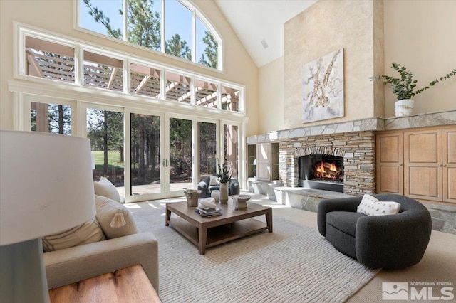 5680 Lausanne Dr, Reno, NV 89511 - carpeted living area featuring high vaulted ceiling and a stone fireplace