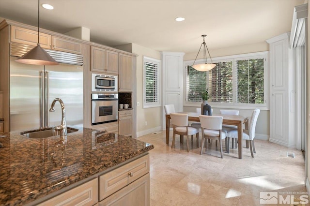 5680 Lausanne Dr, Reno, NV 89511 - kitchen with built in appliances, baseboards, a sink, hanging light fixtures, and recessed lighting