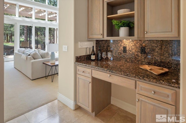 5680 Lausanne Dr, Reno, NV 89511 - bar featuring light carpet, baseboards, backsplash, and light tile patterned floors