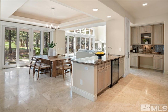 5680 Lausanne Dr, Reno, NV 89511 - kitchen with french doors, a sink, beverage cooler, backsplash, and recessed lighting