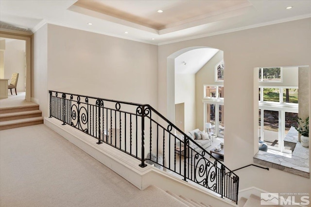 5680 Lausanne Dr, Reno, NV 89511 - hall featuring arched walkways, carpet floors, a raised ceiling, recessed lighting, and crown molding