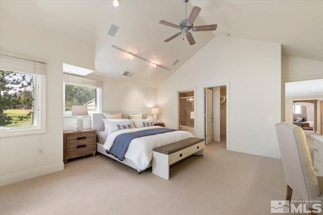 5680 Lausanne Dr, Reno, NV 89511 - bedroom featuring light carpet, baseboards, connected bathroom, high vaulted ceiling, and ceiling fan