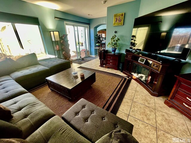 3131 Winter Rose Cir, Reno, NV 89502 - tiled living room featuring arched walkways