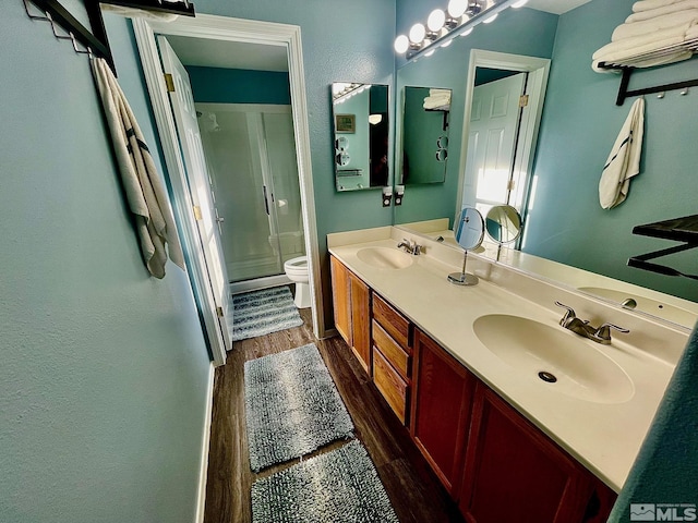 3131 Winter Rose Cir, Reno, NV 89502 - full bath featuring wood finished floors, a shower stall, toilet, and double vanity