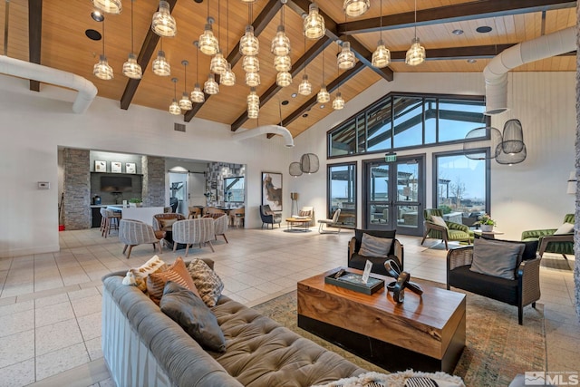 3060 Bristol Dr, Reno, NV 89521 - living room featuring wooden ceiling with exposed beams, high vaulted ceiling, and baseboards