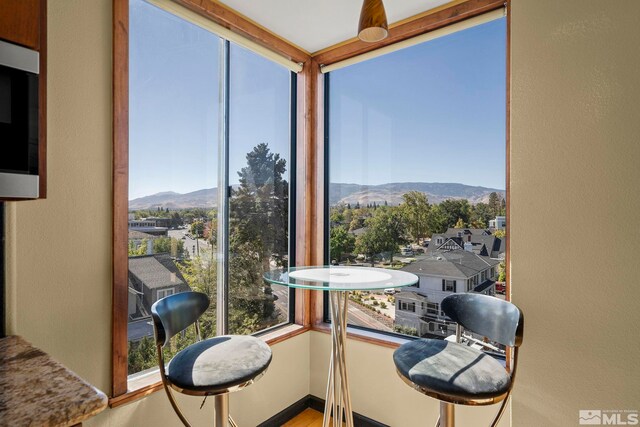 280 Island Ave Apt 802, Reno, NV 89501 - sunroom / solarium featuring a mountain view and plenty of natural light