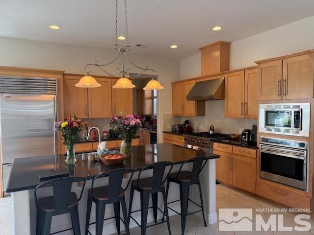 1769 La Cita Way, Minden, NV 89423 - kitchen featuring built in appliances, exhaust hood, light tile patterned floors, a sink, and decorative backsplash