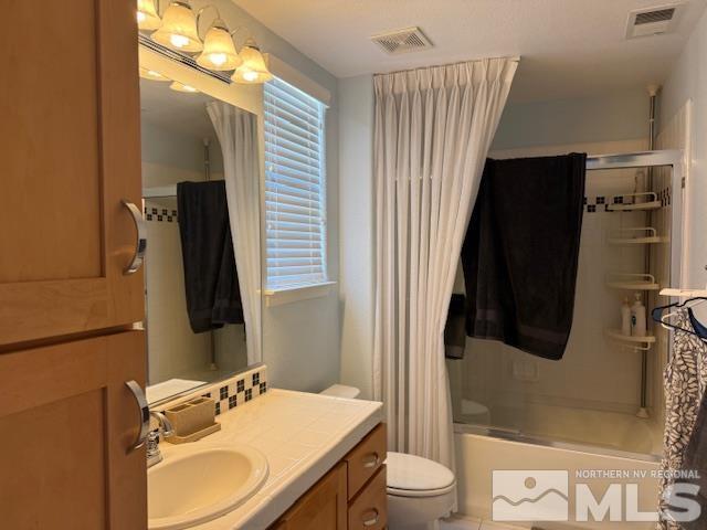 1769 La Cita Way, Minden, NV 89423 - bathroom with toilet, plenty of natural light, shower / tub combo, and vanity