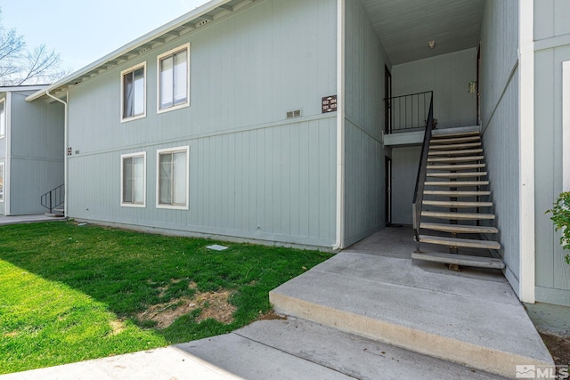 4604 Neil Rd Unit 122, Reno, NV 89502 - view of property exterior with stairway and a yard