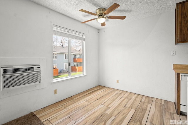 4604 Neil Rd Unit 122, Reno, NV 89502 - unfurnished dining area with a ceiling fan, light wood-style flooring, a textured ceiling, and cooling unit