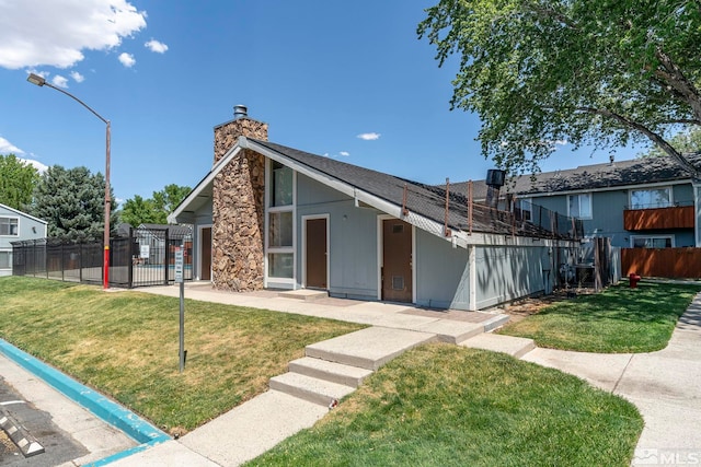 4604 Neil Rd Unit 122, Reno, NV 89502 - mid-century inspired home featuring a chimney and stone siding