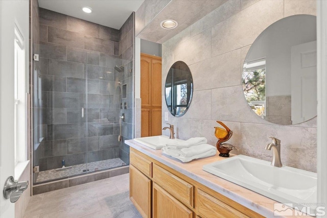 5103 Tucumcari Cir, Reno, NV 89511 - bathroom with tile walls, a shower stall, and double vanity