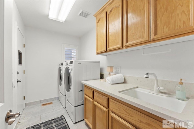 5103 Tucumcari Cir, Reno, NV 89511 - washroom with cabinet space, washing machine and clothes dryer, light tile patterned floors, and baseboards