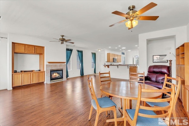 2140 Avella Dr, Sparks, NV 89434 - dining area featuring a ceiling fan, wood finished floors, a fireplace, and recessed lighting