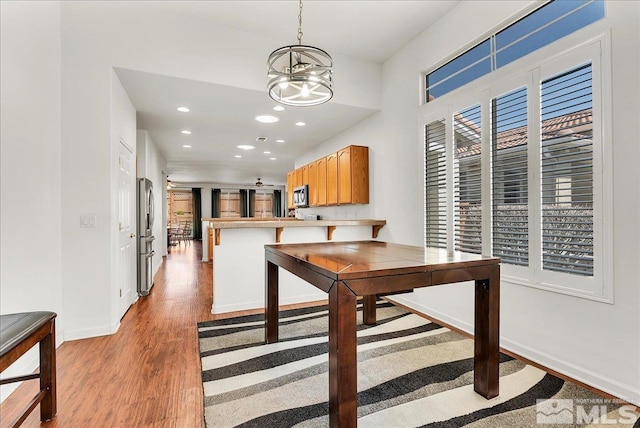 2140 Avella Dr, Sparks, NV 89434 - dining space featuring light wood-style floors, a chandelier, baseboards, and recessed lighting