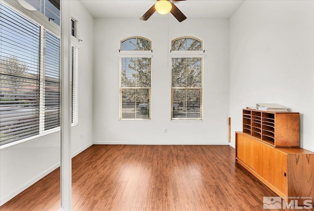2140 Avella Dr, Sparks, NV 89434 - unfurnished room with a ceiling fan, wood finished floors, and baseboards